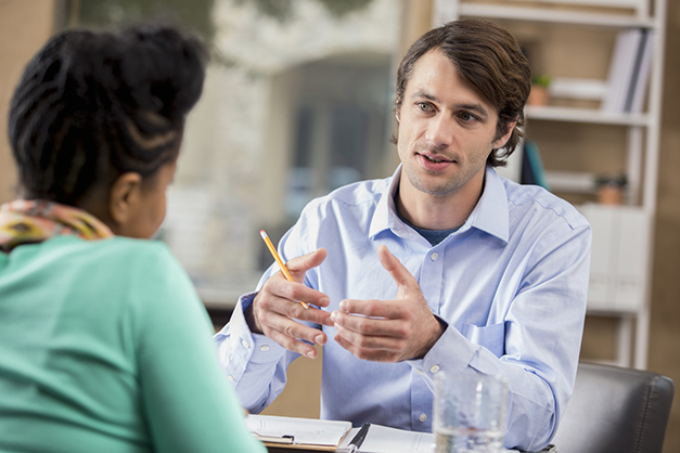 Shot of employees having discussion, concept of talking openly about mental health at workplace.