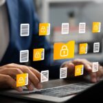 Businessman using laptop to access secure digital folder and document, Cybersecurity, Data privacy, Protected information
