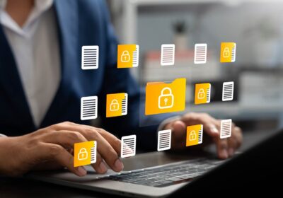 Businessman using laptop to access secure digital folder and document, Cybersecurity, Data privacy, Protected information
